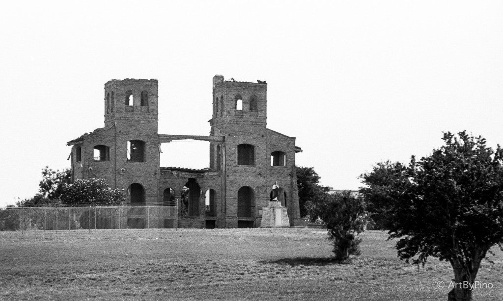 Two-tower brick facade with a statue and chain-link fence, St. Peter's Novitiate, La Lomita, Mission — Rollei Ortho 25 Plus 35mm, Canon A2E