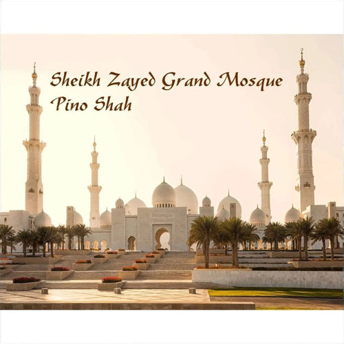 The sheikh zayed grand mosque, a majestic white marble structure with multiple domes and towering minarets.