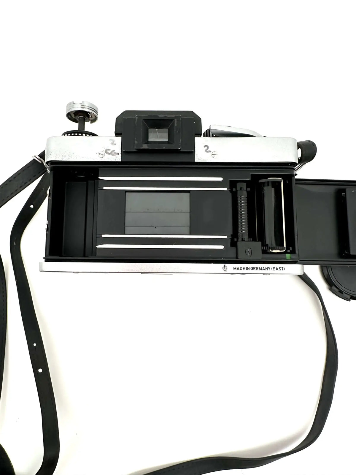 Silver and black rangefinder camera with a classic, retro design.