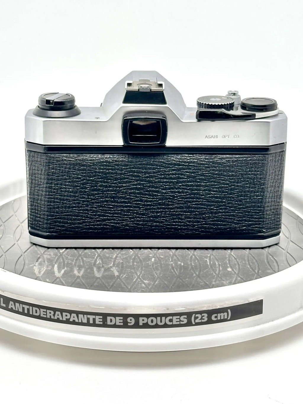 Silver and black asahi pentax 6x7 film camera with textured leather grip.