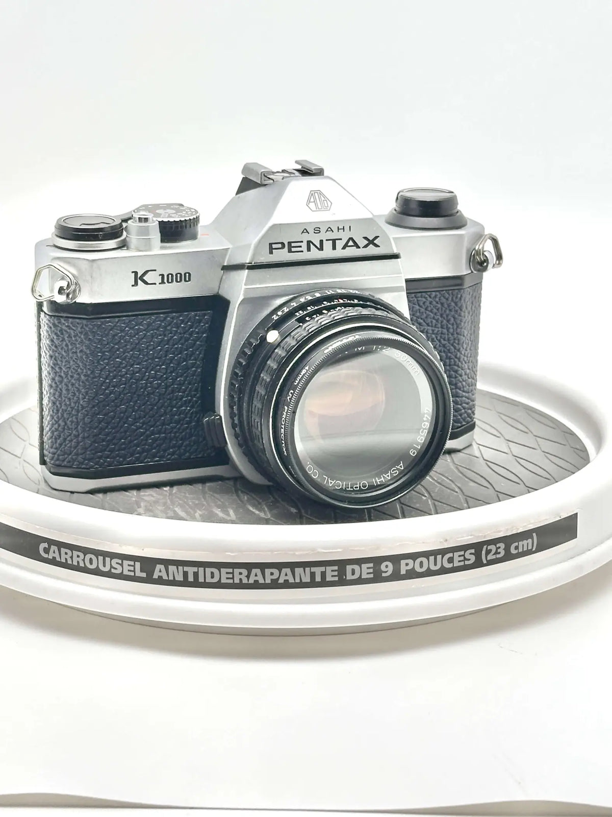 Silver and black asahi pentax k-1000 film camera with a textured leather grip.