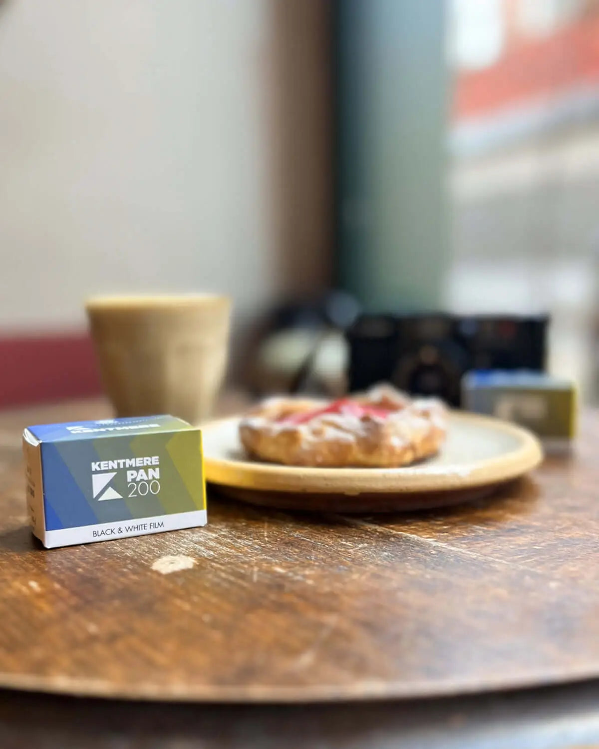 A blue and white box of kentmere pan 200 black-and-white film.