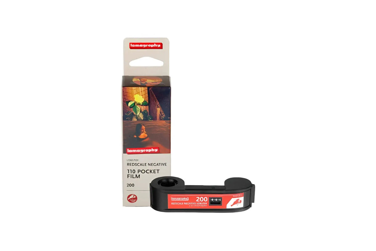 Black lomography 110 pocket film with red and white labeling, featuring a compact roll design for instant photography.