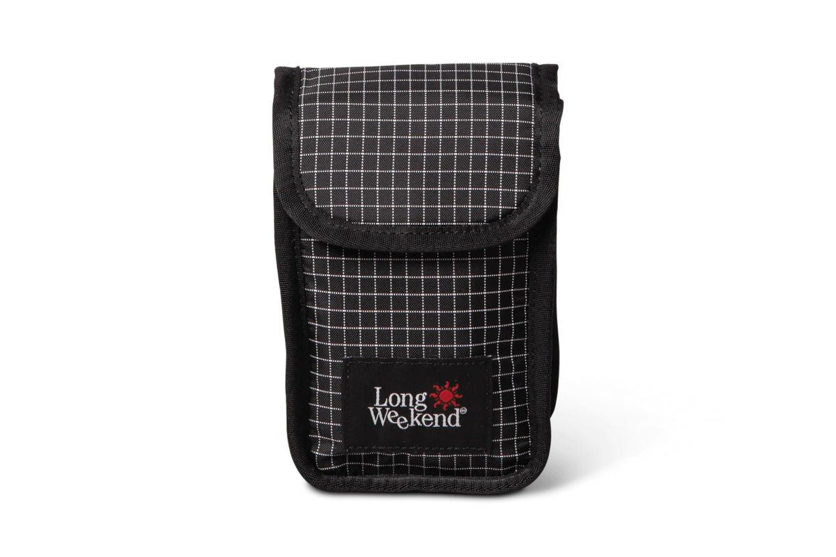 Black and white grid-patterned long weekend phone pouch with a black fabric flap.