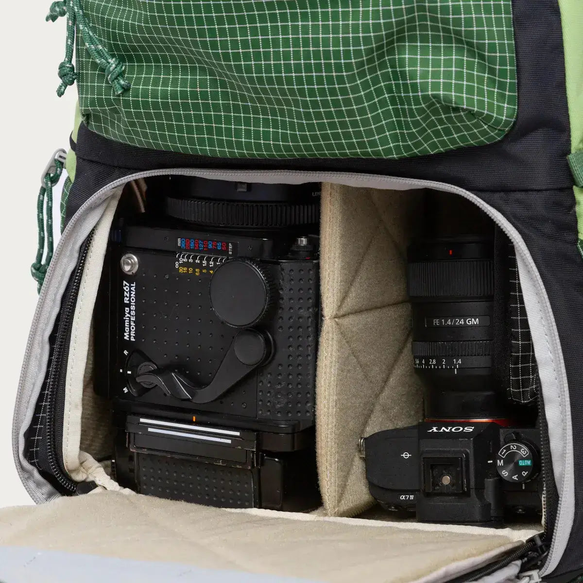 Interior view of Long Weekend Morro Convertible Backpack showcasing camera compartments for gear organization.