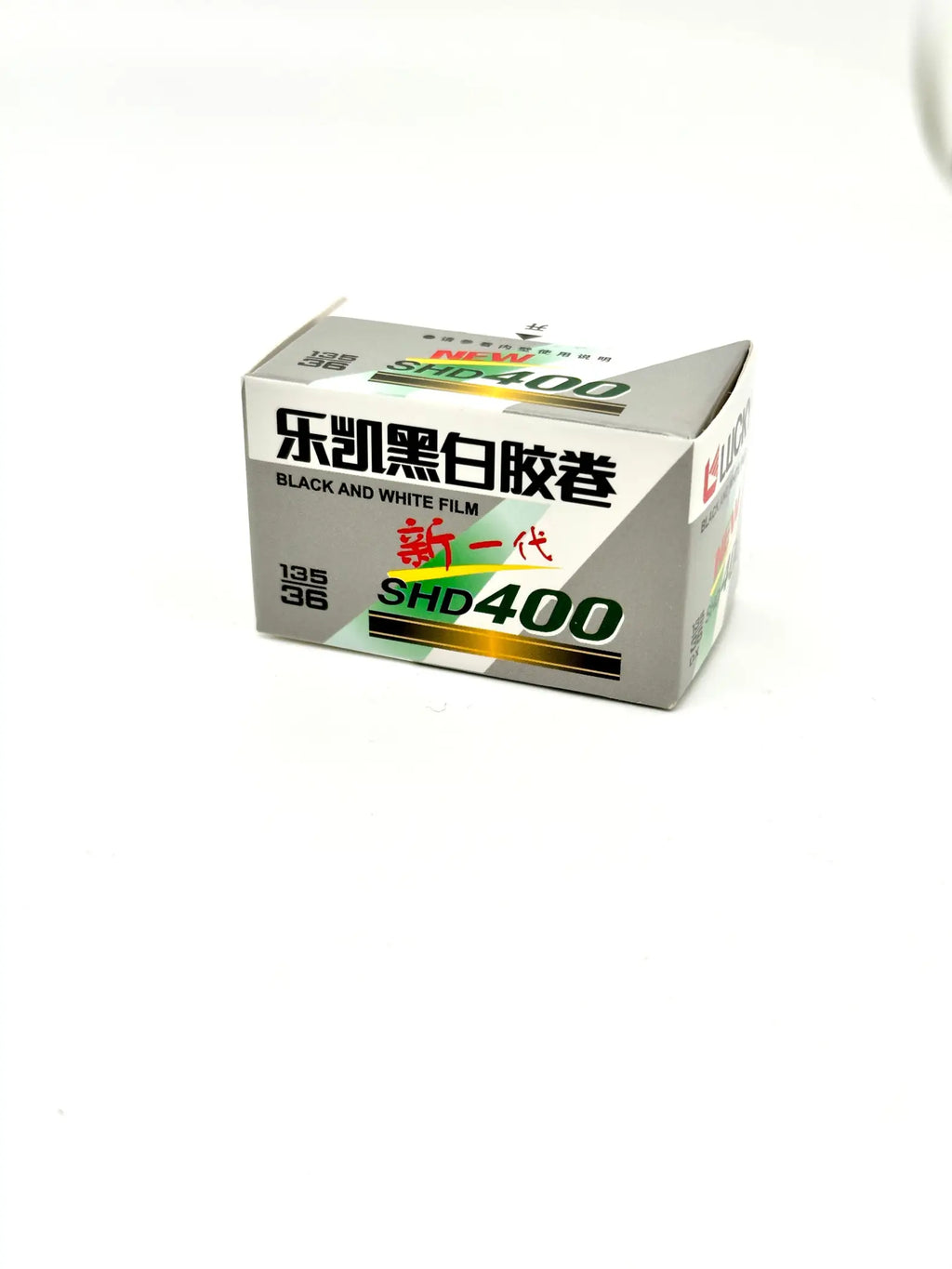 Silver and green labeled box of kodak shd400 black-and-white film.