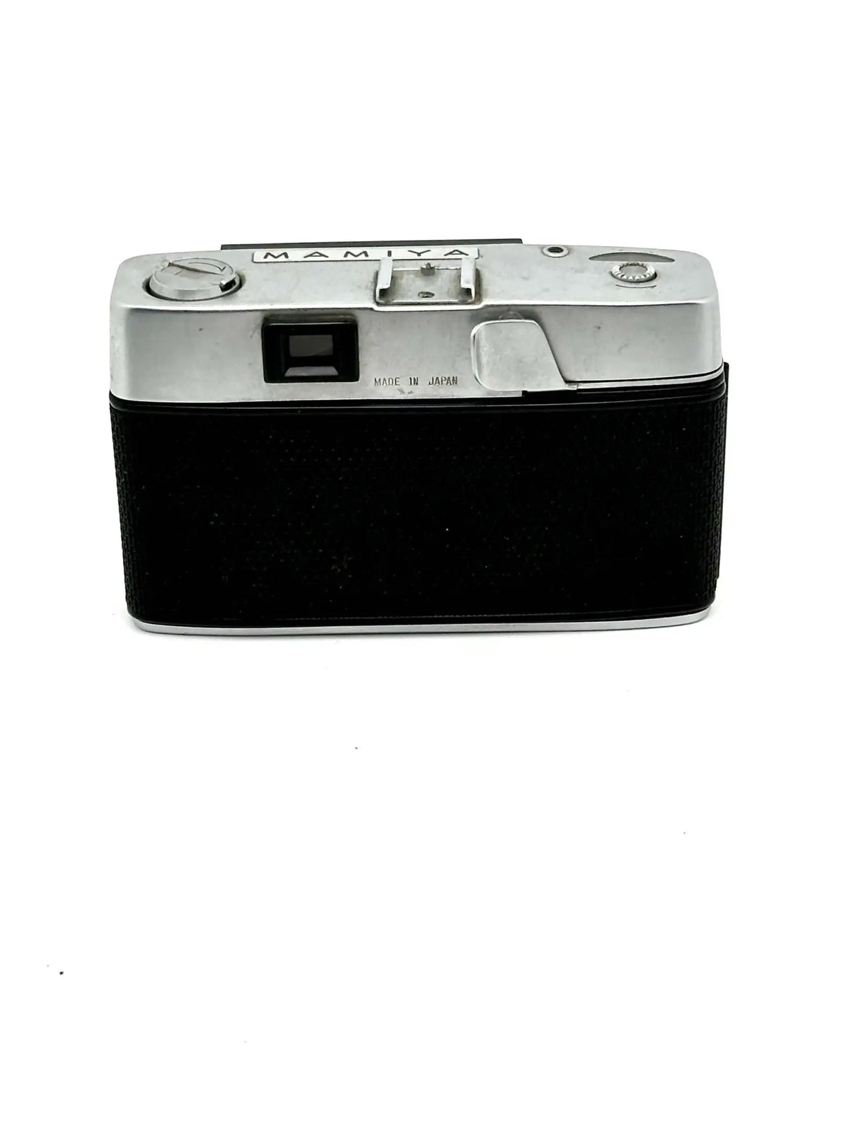 Silver-bodied mamiya film camera with a black textured leather grip.