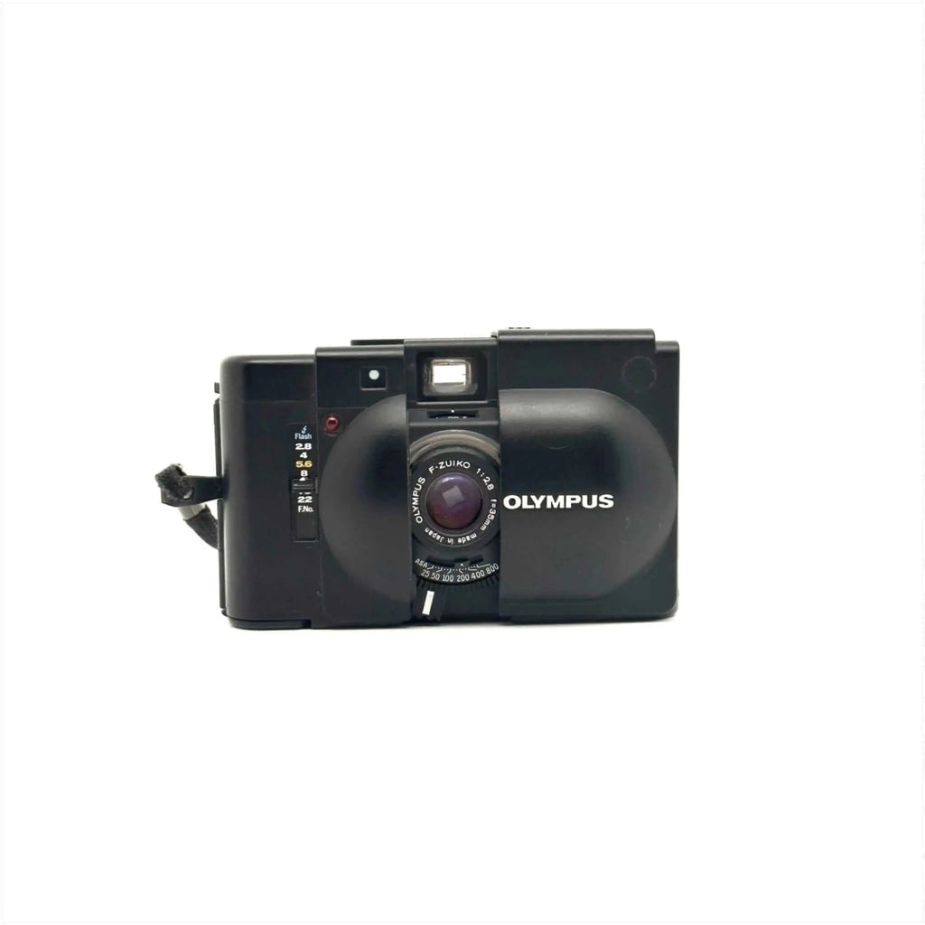 Black olympus xa-1 instant camera with a rounded lens and film counter.