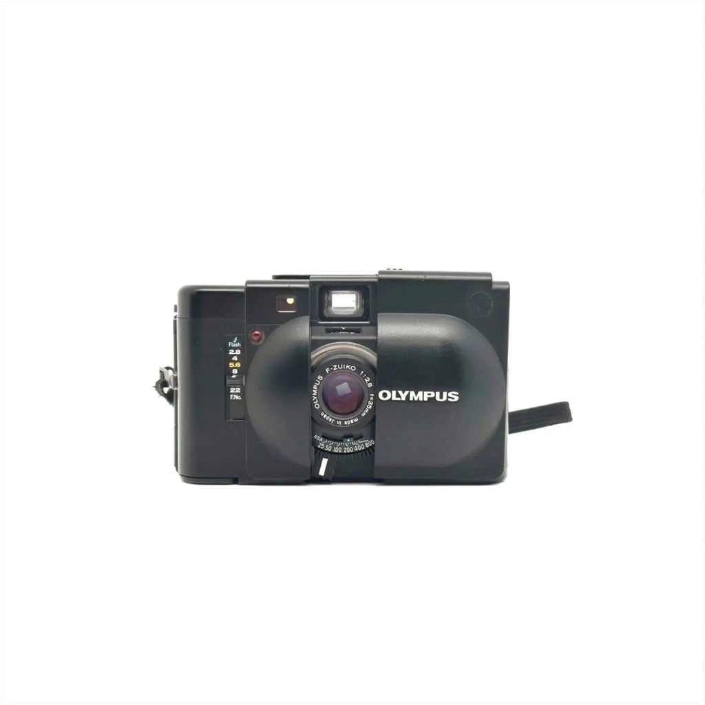 Black olympus c-203 compact camera with a prominent lens and built-in flash.