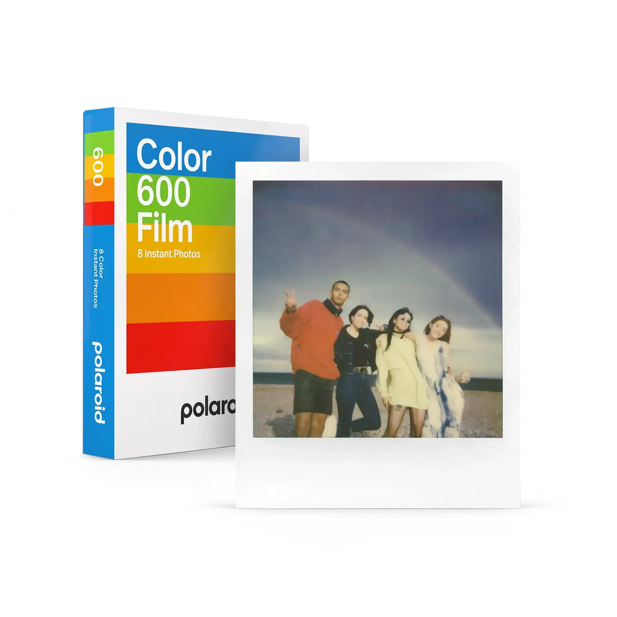 Polaroid color 600 film pack with rainbow-striped box and a white-bordered instant photo of four people on the beach.