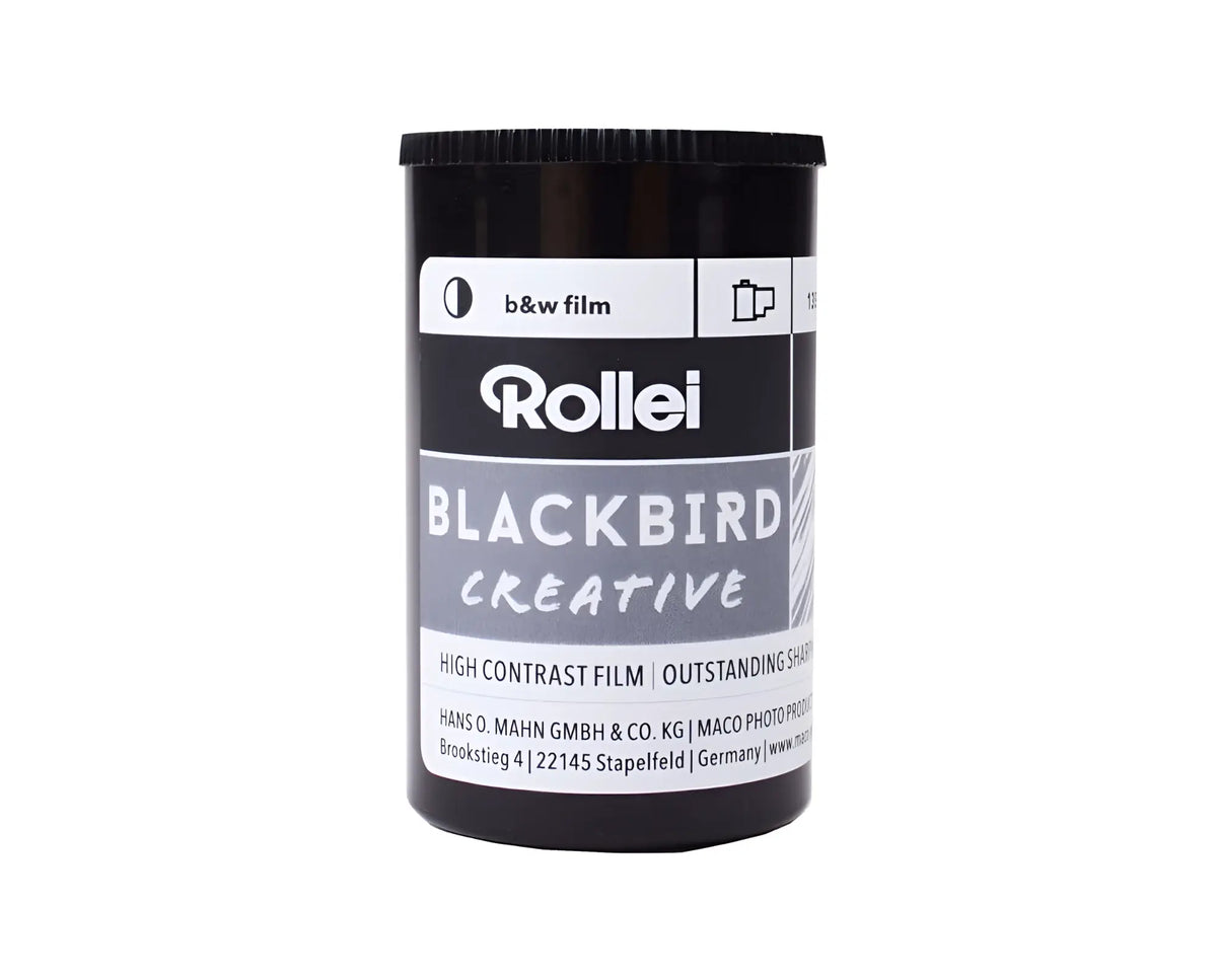 Black cylindrical canister of rollei blackbird creative high contrast black and white film.