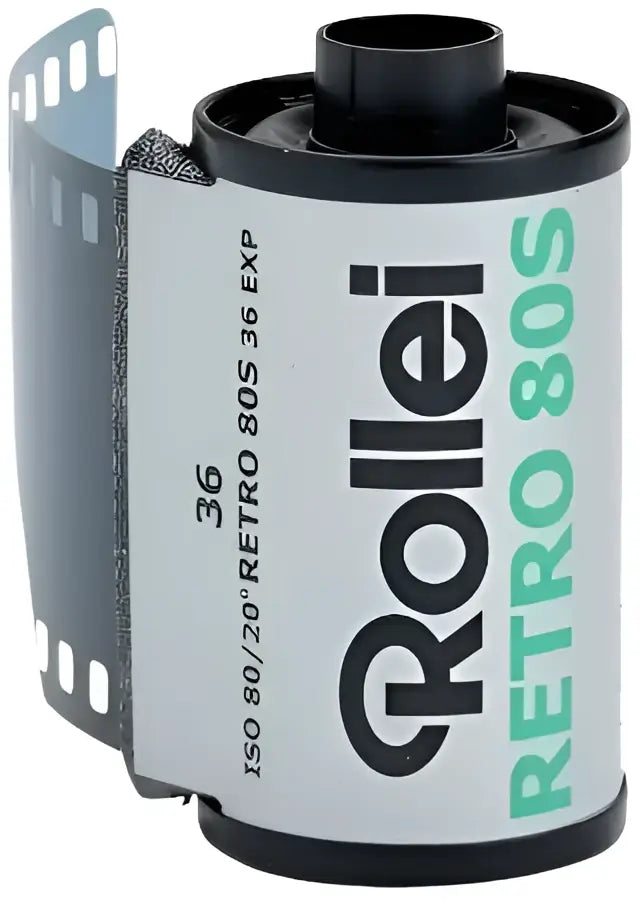 A black and white rollei retro 80s film roll with a silver label, featuring green text for the model name.