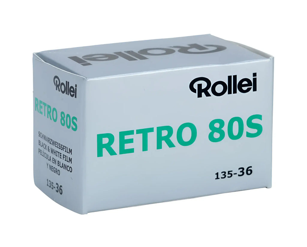 Silver rollei retro 80s black and white film box with green lettering.